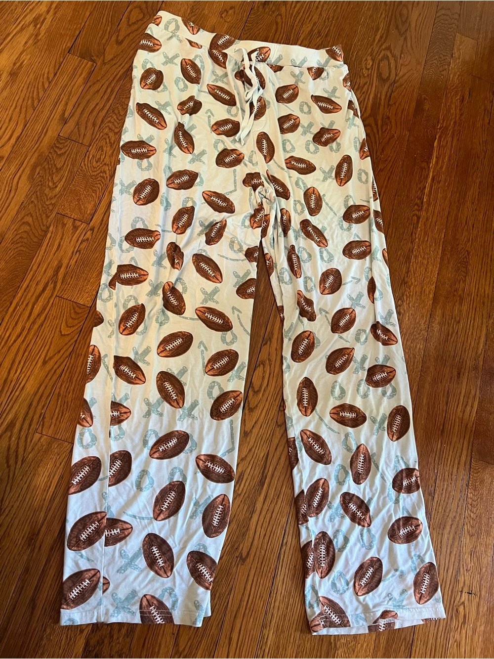 Posh Peanut Cream Pajama Pants with Brown Footballs and Light Blue Accents